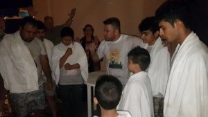 Kurdish Church--Osama preaching to those being baptized copy